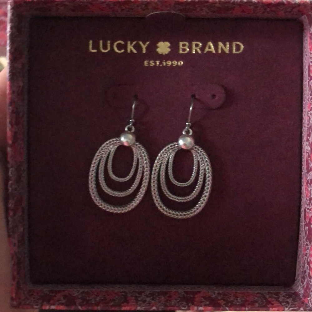 New in Box silver earrings